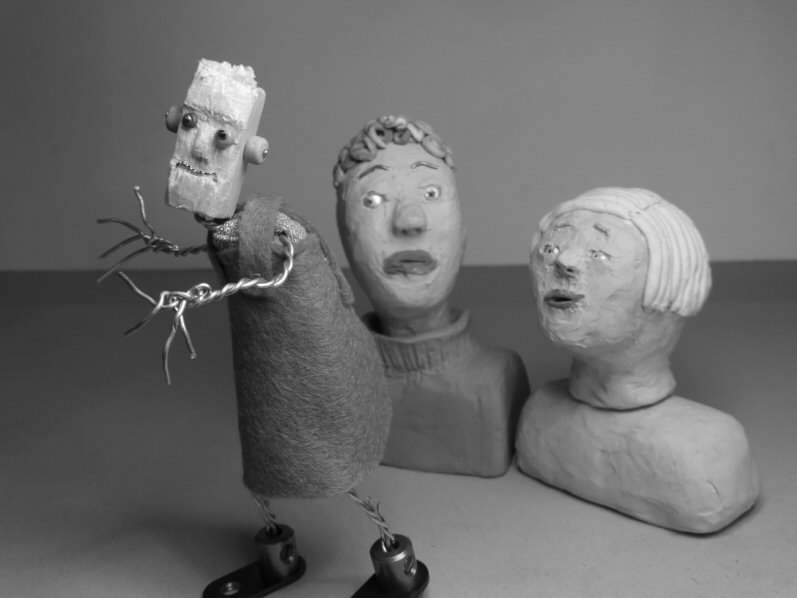 two plasticine heads and wire puppet