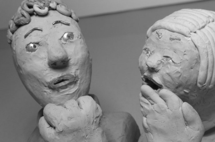 one plasticine head laughs at another